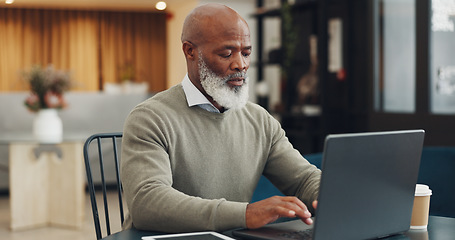 Image showing Senior, black man and typing on laptop in coffee shop, research or social media. Cafe, tech and elderly businessman from Nigeria on pc working on online project, thinking and writing email at table.