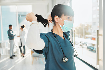Image showing Covid, window and doctor at a hospital for healthcare, medical work and thinking. Idea, hair care and nurse wearing a face mask for a virus while working at a clinic, looking at view and medicare