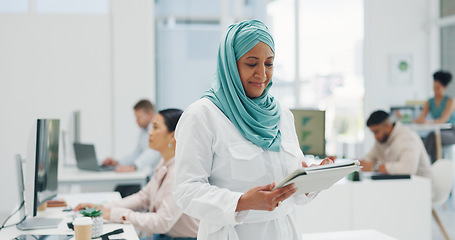 Image showing Office, business and muslim woman on tablet for research, internet browsing or social media. Technology, break and mature Islamic female holding touchscreen for networking, typing or writing email.