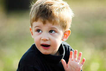 Image showing boy waving hand