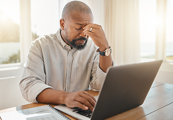 Image showing Black man, laptop and headache in remote work suffering from burnout, stress or anxiety at home. Tired African American businessman freelancer with sore head, pain or strain by computer on table