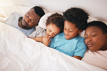 Image showing Sleeping, black family and children with parents in a bed feeling tired in the morning. Bonding, parent love and support with kids, dad and mother resting at home in a house bedroom together