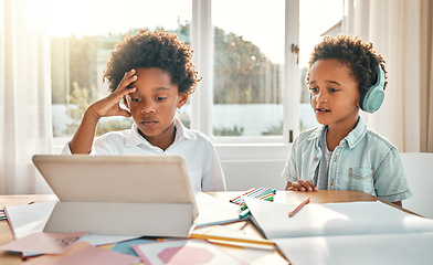 Image showing Digital tablet, headphones and children doing distance learning together in the dining room at home. Technology, home school and boy kids or brothers watching a class on mobile device in their house.