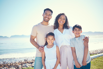 Image showing Relax, smile and portrait of family at beach for vacation, bonding and summer break. Holiday trip, travel and care with parents and children on field by sea for positive, affectionate or quality time