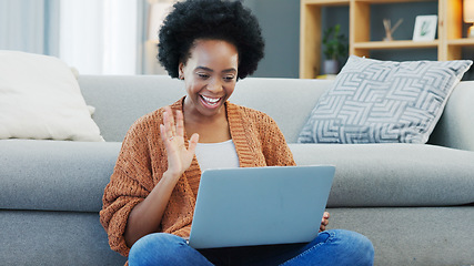 Image showing Happy African American woman using laptop and waving on a video call in a living room. Young black female having a casual chat with friends at home. Lady excited to talk to her family during lockdown