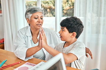 Image showing Learning, high five and child knowledge development at home with grandparent teacher. Teaching, elderly woman help and homework achievement hand gesture of a senior person and kid at a house