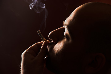 Image showing smoking man