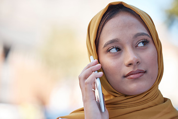 Image showing Muslim woman in city on a phone call, cellphone communication or 5g International update, news or conversation. Young islamic, Urban outdoor hijab or Saudi Arabia person talking on mobile smartphone