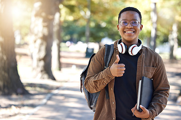 Image showing Black man, portrait or thumbs up on campus, park nature or garden in college review, university like or school vote. Smile, happy or student with thumb hands for learning success or education growth