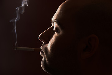 Image showing smoking man