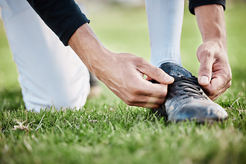 Image showing Closeup, fitness and man tie shoe, hands and exercise for wellness, healthy lifestyle and on field. Zoom, male athlete and player with shoelace, training or workout for balance, sports or competition