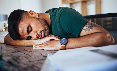 Image showing Tired, burnout and man sleeping on a desk after studying, education or stress from remote work. Lazy, nap and student with fatigue, sleep and resting after learning, exam preparation and homework