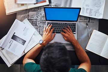 Image showing Hands, laptop and overhead with an architect man at his desk, working on design or a building plan. Computer, architecture and blueprint with a male engineer at work on a development project