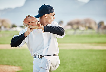 Image showing Baseball, pitcher and sports with man on field of stadium for training, practice and workout. Fitness, exercise and action with athlete throwing ball in game in park for competition, match and skill