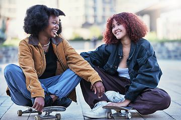 Image showing Fun, skateboard and women in city, relax and workout with wellness, gen z and activity with happiness. Friends, girls and skaters with smile, quality time and fitness in town, resting or conversation