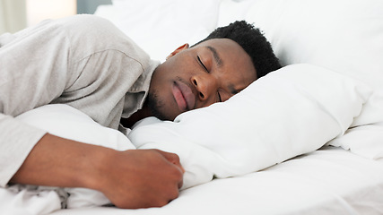 Image showing Sleep, relax and dream for a black man home in bed on a weekend morning. Tired, sleeping and dreaming in bedroom alone. Relaxing, peace and comfort with head on pillow for sleepy time in bright room.