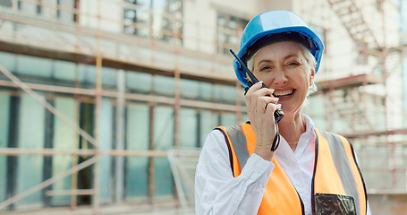 Image showing Engineering, construction site and woman in communication on a walkie talkie building a development project outside. Smile, contractor and happy senior manager talking or speaking on safety on radio