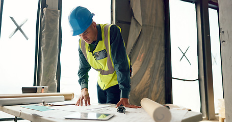 Image showing Man, architect or engineer and planning for inspection, construction or maintenance in safety and security on site. Male engineer, builder or contractor checking project plans for industrial architec