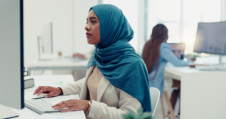 Image showing Muslim, business woman and typing on computer in office, startup company and digital management, internet planning and strategy review. Employee with islamic hijab working online for seo website tech