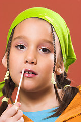 Image showing child applying make-up