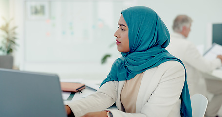 Image showing Muslim, business woman and typing on computer in office, startup company and digital management, internet planning and strategy review. Employee with islamic hijab working online for seo website tech