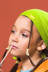 Image showing child applying make-up