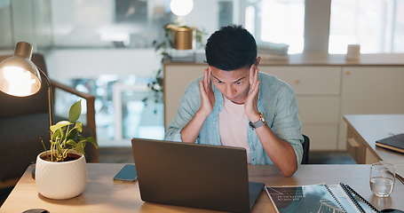 Image showing Laptop, business asian man and stress, tired or headache working in office with fatigue, anxiety or depression. Sad, depressed and mental health risk of digital online worker or employee burnout and