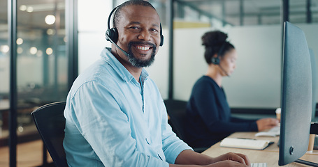 Image showing Call center, customer support and face of black man at desk working on computer, online and telemarketing. Crm, contact us and portrait of consultant for friendly service, help and customer service