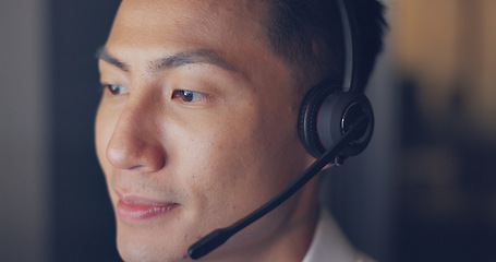 Image showing Call center, consultant and man with face and contact us, phone call zoom with communication and headset. Telemarketing, customer service or tech support, speaking to client and Asian agent help desk