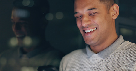 Image showing Face, phone and dark with a business man laughing in an office, working late at night on a deadline. Mockup, contact and good news with a male employee typing a text message at work during overtime