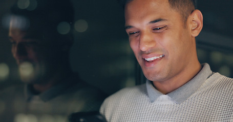 Image showing Face, phone and dark with a business man laughing in an office, working late at night on a deadline. Mockup, contact and good news with a male employee typing a text message at work during overtime