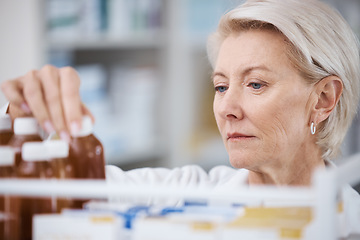 Image showing Senior woman, pharmacist and medical stock check in a pharmacy for drug information. Healthcare, wellness and working elderly person with pharmaceutical drugs reading bottle product ingredients