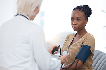 Image showing Healthcare, checkup and black woman with a doctor for blood pressure, hypertension and cardiology. Medical, service and African patient with a gp for a routine consultation to monitor the heart