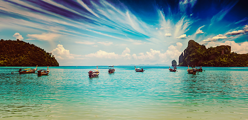 Image showing Long tail boat at beach on sunset