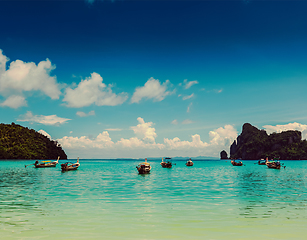 Image showing Long tail boats in bay. Thailand