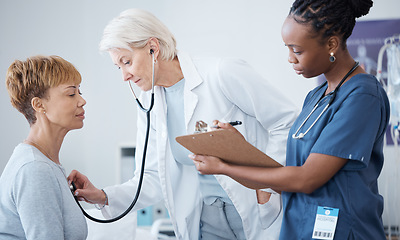 Image showing Checkup, routine and woman with doctors for healthcare, consulting and check on health. Medical, cardiology and mature patient with a gp and nurse for an appointment, examination or vitality tests