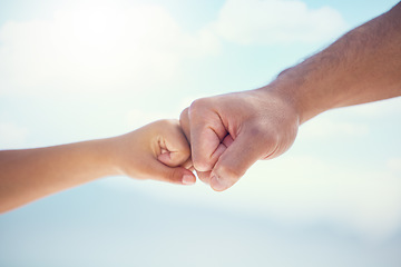 Image showing Hands, fist bump and growth in unity, partnership or trust for childhood development on mockup. Small and big hand bumping fists in support, collaboration or teamwork for community or friendship