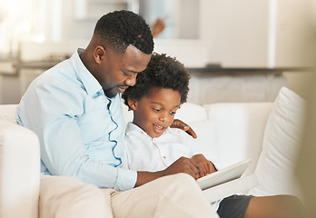 Image showing Love, sofa and father reading with his child while relaxing together in the living room of their home. Happy, bonding and African man enjoying a book, story or novel with his boy kid in family house.