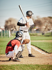 Image showing Baseball, bat and focus with a sports man outdoor, playing a competitive game during summer. Fitness, health and exercise with a male athlete or player training on a field for sport or recreation