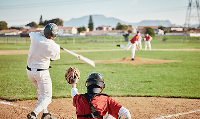 Image showing Baseball, bat and strike with a sports man outdoor, playing a competitive game during summer. Fitness, health and exercise with a male athlete or player training on a pitch for sport or recreation