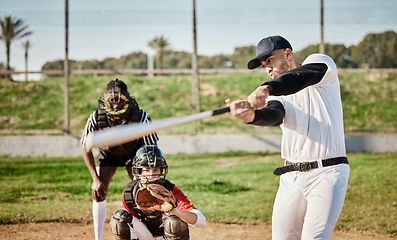 Image showing Baseball, bat and swinging with a sports man outdoor, playing a competitive game during summer. Fitness, health and exercise with a male athlete or player training on a field for sport or recreation