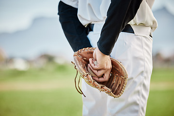 Image showing Hands, back view or baseball player training for a game or match on outdoor field or sports stadium. Fitness, softball or focused man pitching or holding a ball with glove in workout or exercise