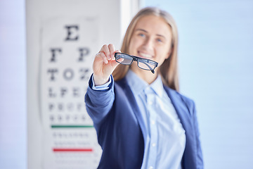 Image showing Optometry, vision and portrait of a woman with glasses with prescription lens after a eye test. Healthcare, eyewear and female patient or customer holding spectacles frame for sight in optical store.