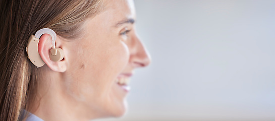 Image showing Mockup, deaf and woman with ear piece, disability and health against a grey studio background. Female, lady and hearing aid for help, success with tech and happiness with listening device and medical