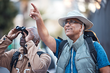 Image showing Binoculars, city and men pointing outdoor for travel, explore vacation or tourist adventure walk. Happy friends, tourism and sightseeing search in sky, lens or journey direction of holiday experience