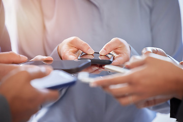 Image showing Hands, phone and networking with business people sharing information or data in their communication office. Contact, mobile or bluetooth with a group of colleagues at work to share media on a network