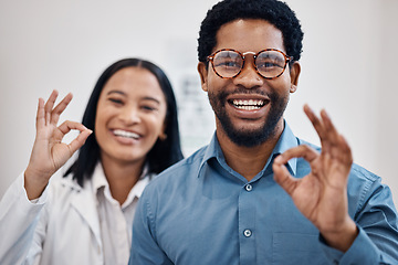 Image showing Perfect, optometry and portrait of a black man and optician with glasses, eyecare and choice of eyewear. Okay, happy and patient with a decision on eyeglasses with an optometrist and hand gesture