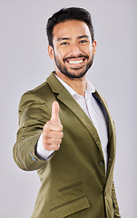 Image showing Business portrait, smile and Asian man with thumbs up in studio isolated on a gray background. Ceo, boss and happy male entrepreneur with hand gesture or emoji for yes, success agreement or thank you