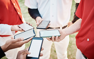 Image showing Hands, phone and baseball with a team networking outdoor on a sport field for strategy or tactics before a game. Teamwork, fitness and communication with a group of people sharing sports information