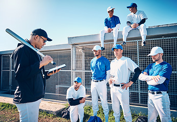 Image showing Sports, baseball and coach talking to the team on the field before a game, workout or training. Fitness, discussion and trainer planning a strategy with a male sport group before a match or practice.